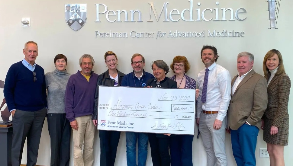 Members of A Love for Life and Penn Medicine holding $100,000 check.