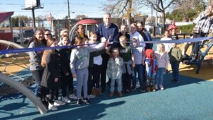 PIC Enthusiastic kids are ready to play as a ribbon is cut opening an improved playground at the Fox Chase Recreation Center.