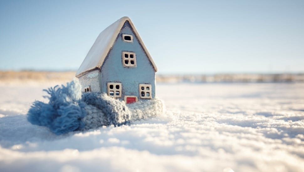 Toy house wrapped in scarf