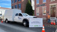 Aqua PA truck in front of a worksite.