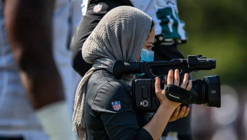 Ameena Soliman recording the Eagles through a camera.