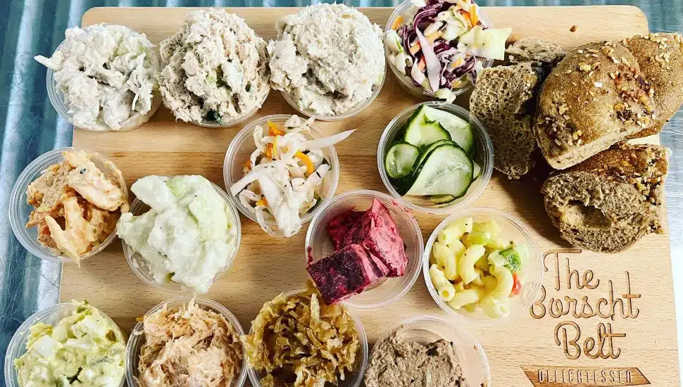 A collection of menu items on a Borscht Belt Delicatessen board.