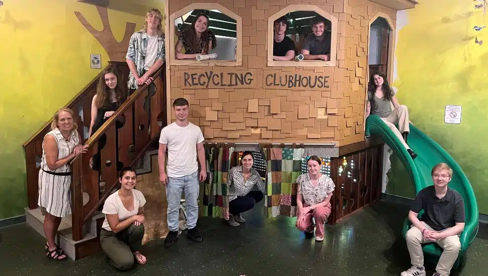 Members of FCP’s 2023 Summer Youth Corps program joined Bucks County Children’s Museum Executive Director Kelly Krumenacker (left) in front of its Treehouse exhibit
