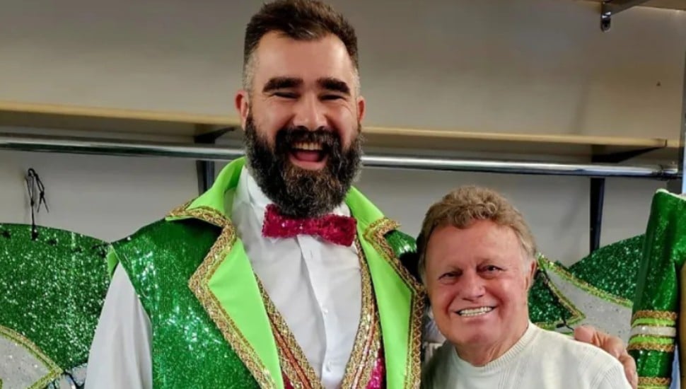 Jason Kelce dons part of his ESPN late night show suit, created by Ridley costumer James May, standing next to him.