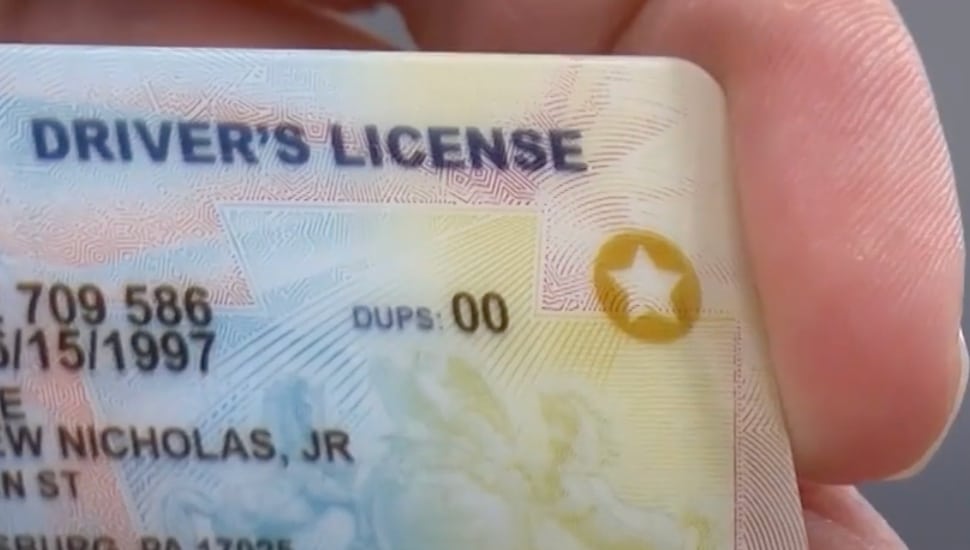 The corner of a PA driver's license.