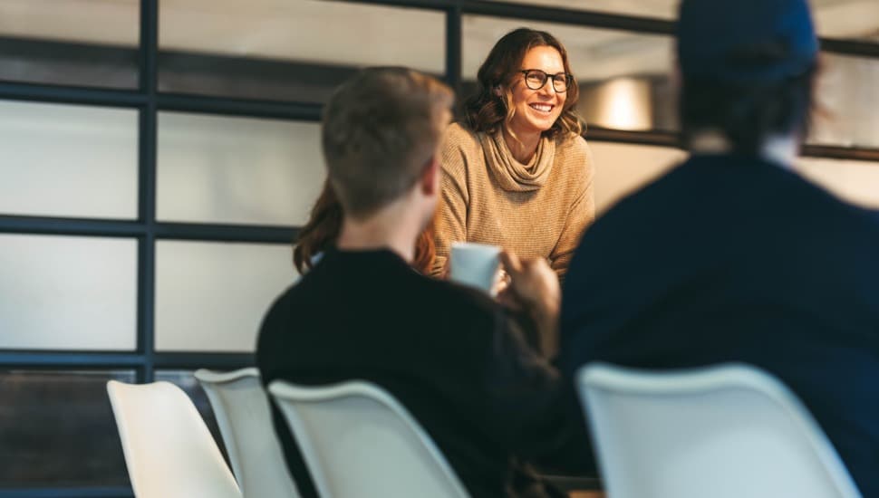 Businesswoman leads a meeting.