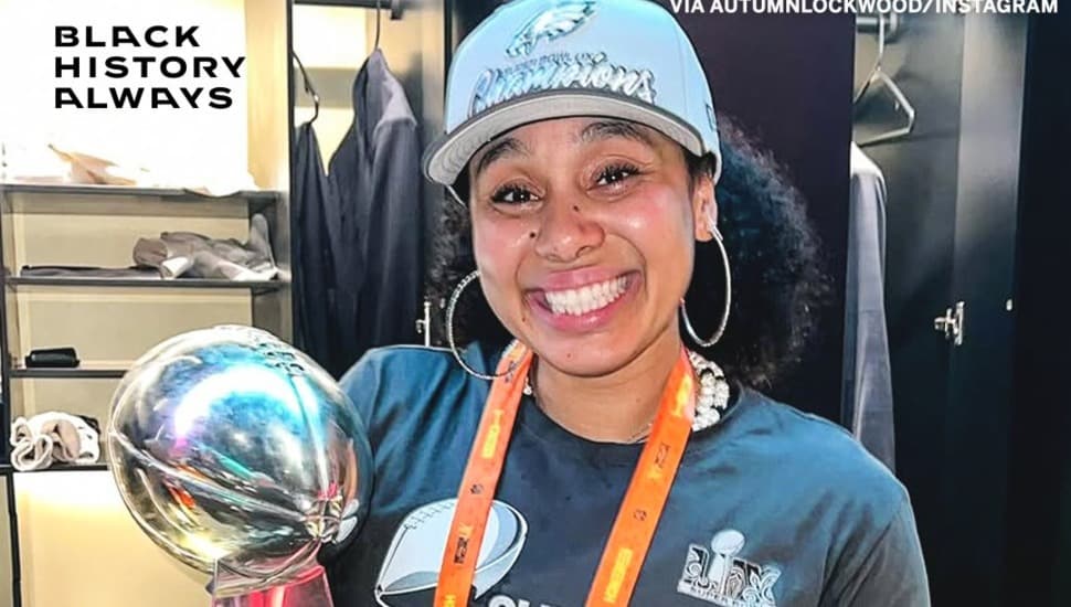 Autumn Lockwood holding the Lombardi Trophy.