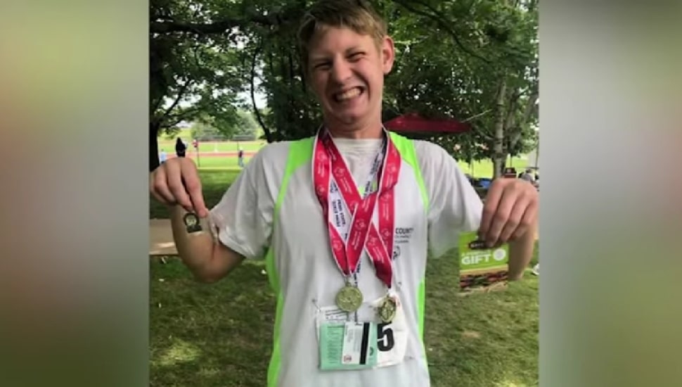Karl Dickersbach with medals around his neck.
