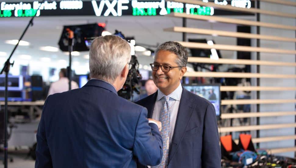 Salim Ramji shaking hands with man.