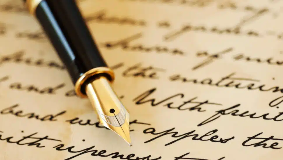Calligraphy on paper with a pen.