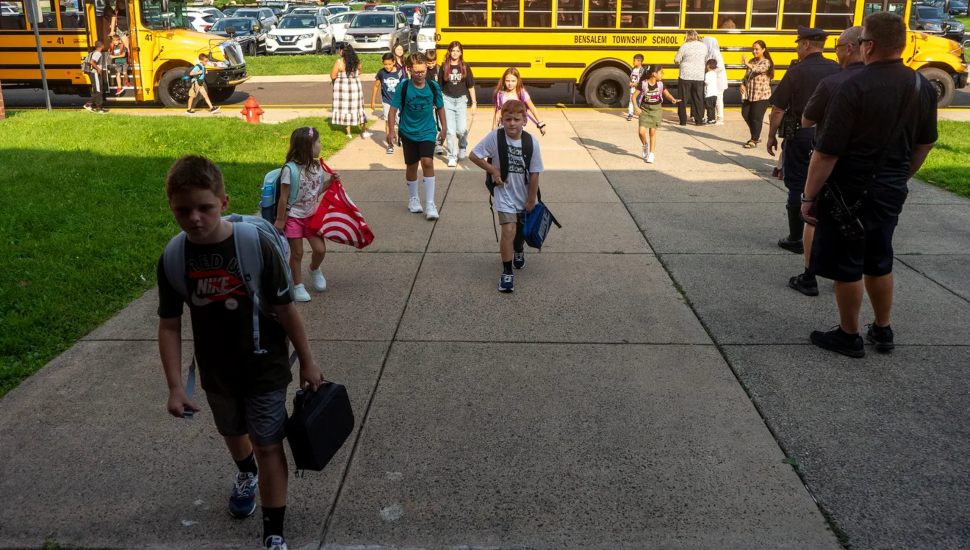Students head to school on their first school day at Cornwells Elementary School in Bensalem.