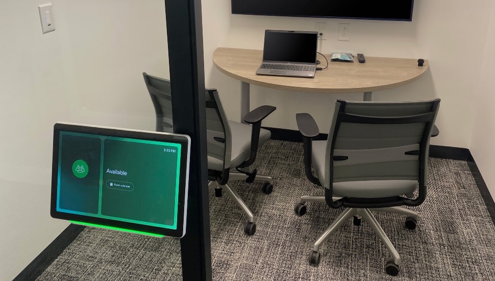 Conference room with scheduling system.