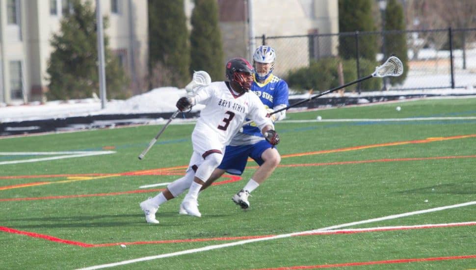 A Bryn Athyn College Lacrosse player on offense.