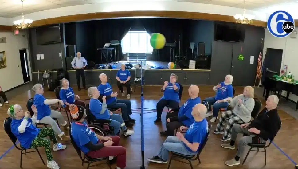 Seniors at Central Bucks Senior Activity Center playing chair volleyball.