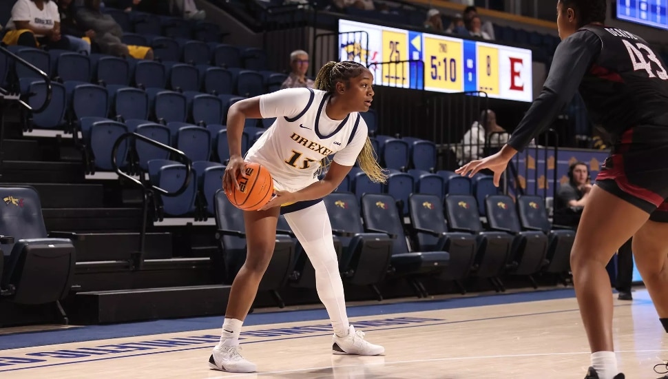 Deja Evans looks to pass the ball.