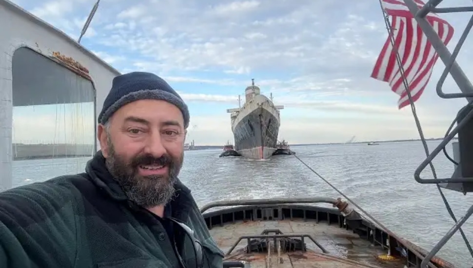 Mike Vinik on his tug boat pulling the SS United States.