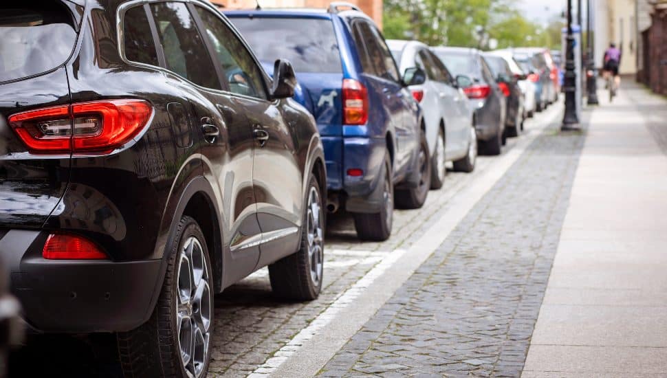 A line of parallel parked cars.