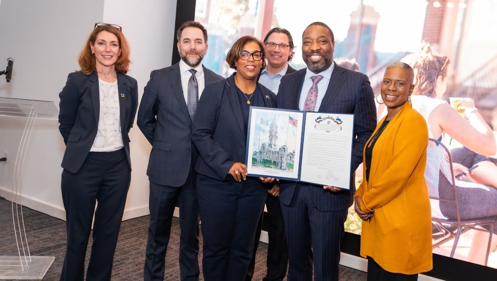 City officials, PIDC, and Navy Yard representatives hold a resolution honoring 25 years of the Navy Yard.
