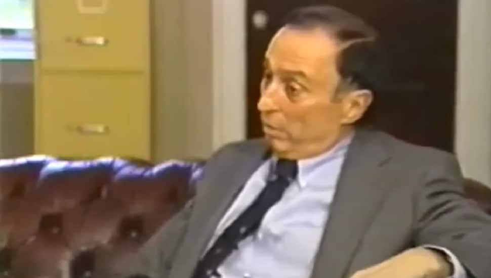 Vincent Salandria sitting on a couch.
