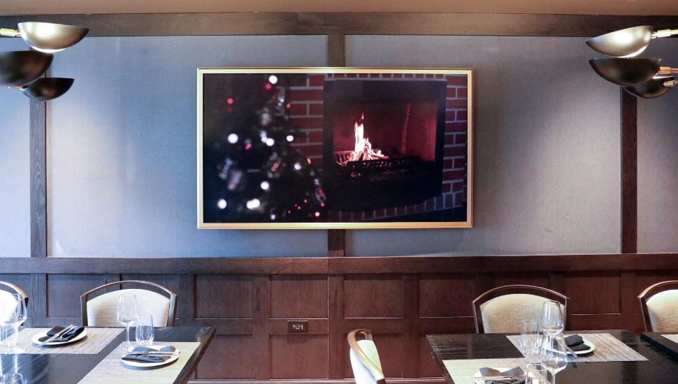 TV on wall in a restaurant.