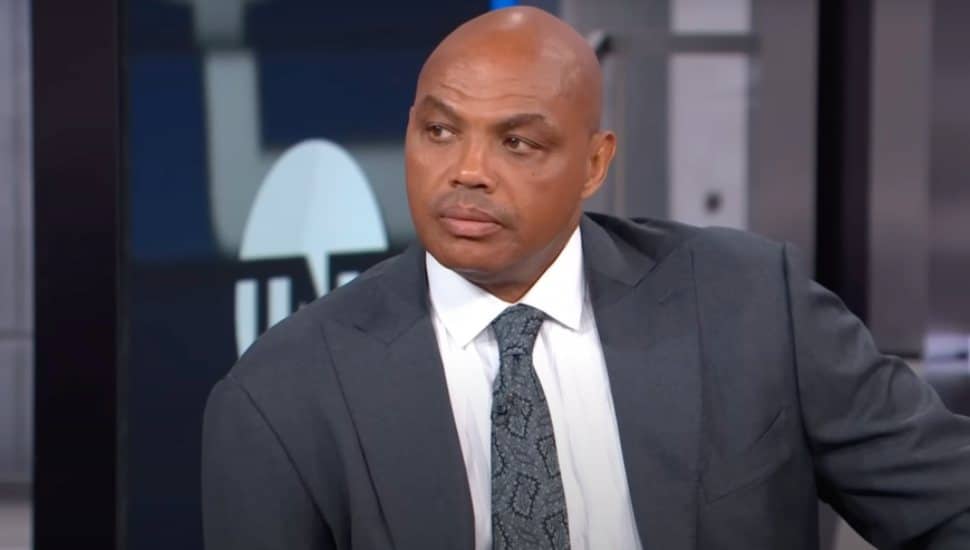Charles Barkley wearing a grey suit.