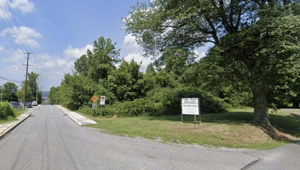 Corner of an empty lot and a road in Coatesville.