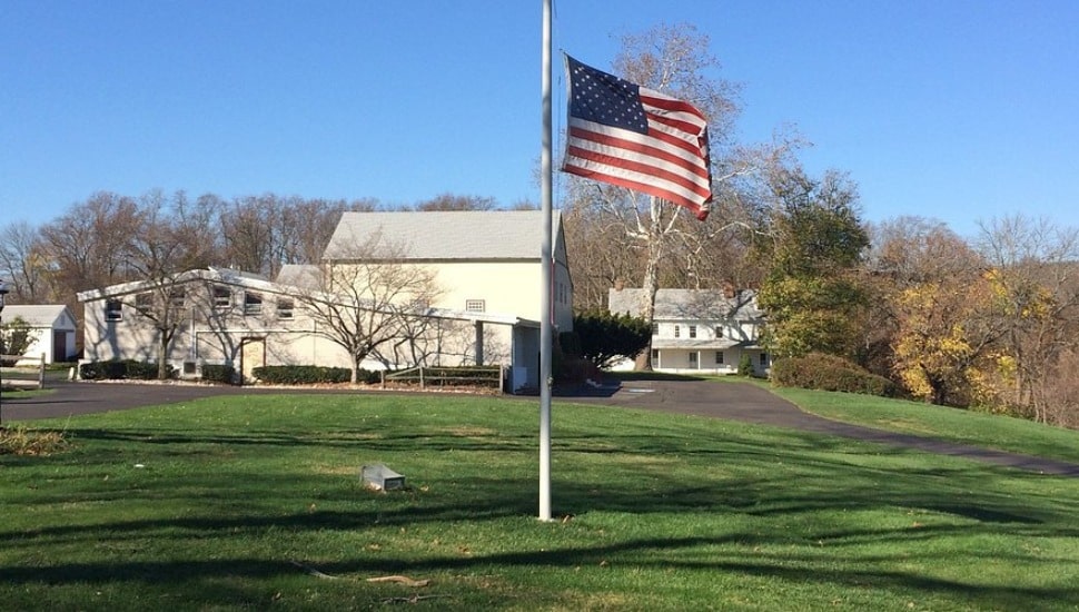 David Library site in Washington Crossing with American flag in front.