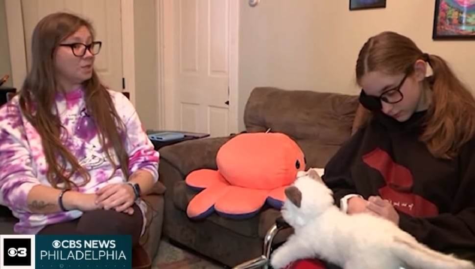 Lily Tomlinson (right) sitting with her mom, Kelsey (left).