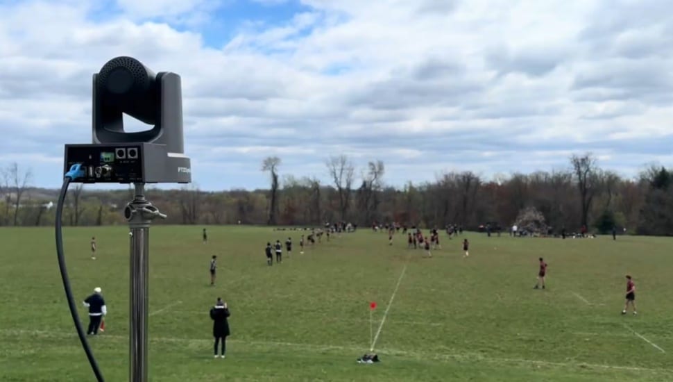 A livestreaming camera films a rugby match.