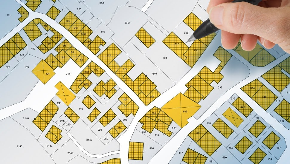 Imaginary cadastral map with buildings, land parcel and vacant plot - Land records and property registry concept with cadastre documentation and ownership parcel identification