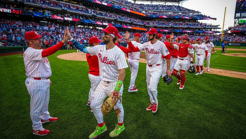 Phillies players giving out high-fives at Citizens Bank Park.