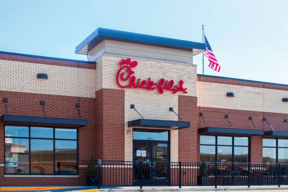 A Chick-fil-A restaurant. with an American flag.