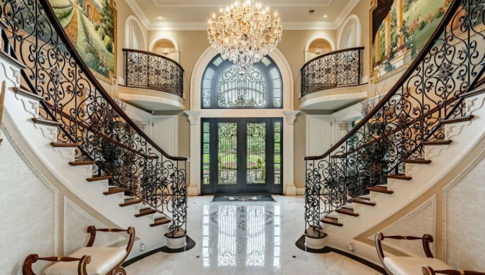 Inside the Ivy Manor, looking at the two wrap-around staircases.