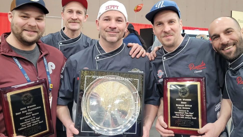 Mezzaluna Wood Fired Pizza crew with their awards in hand.