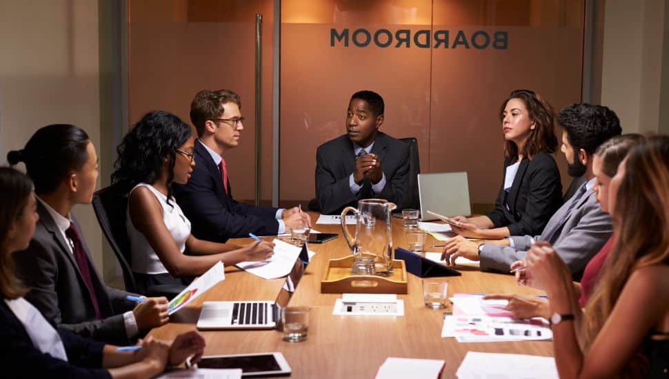 Executives around a boardroom table.