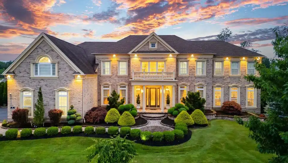 Large brick exterior with manicured lawn.