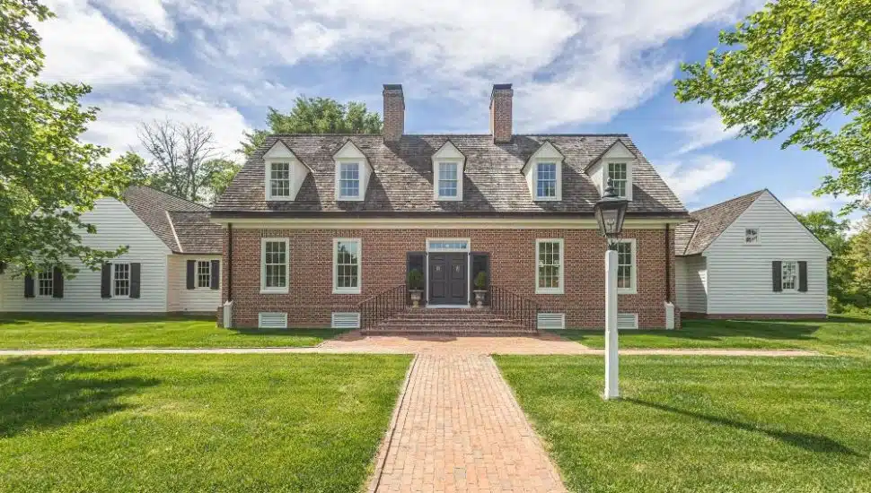 71 Covered Bridge Rd brick house exterior with front lawn.