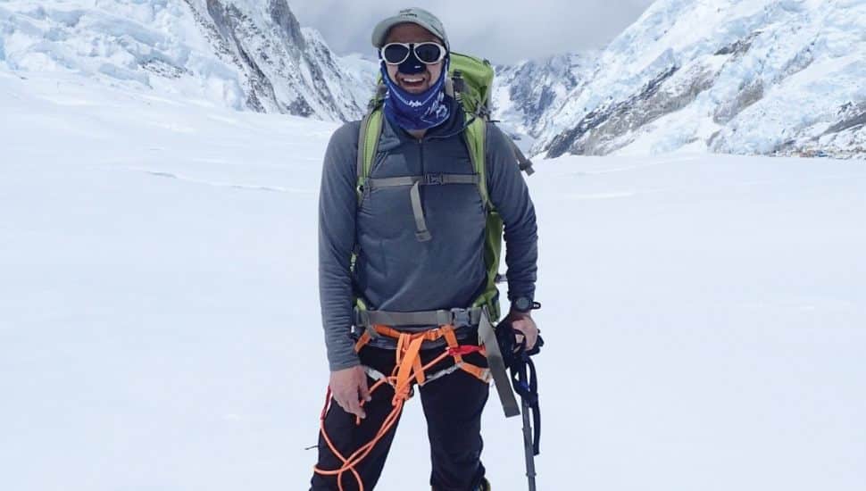 Wayne dentist Bruce Terry standing on a mountain.