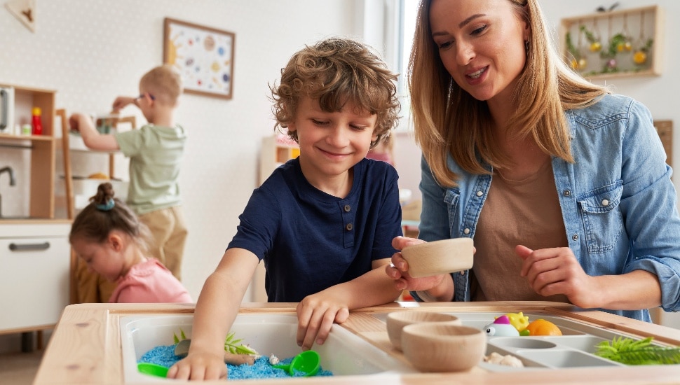 Child Care provider with young boy.