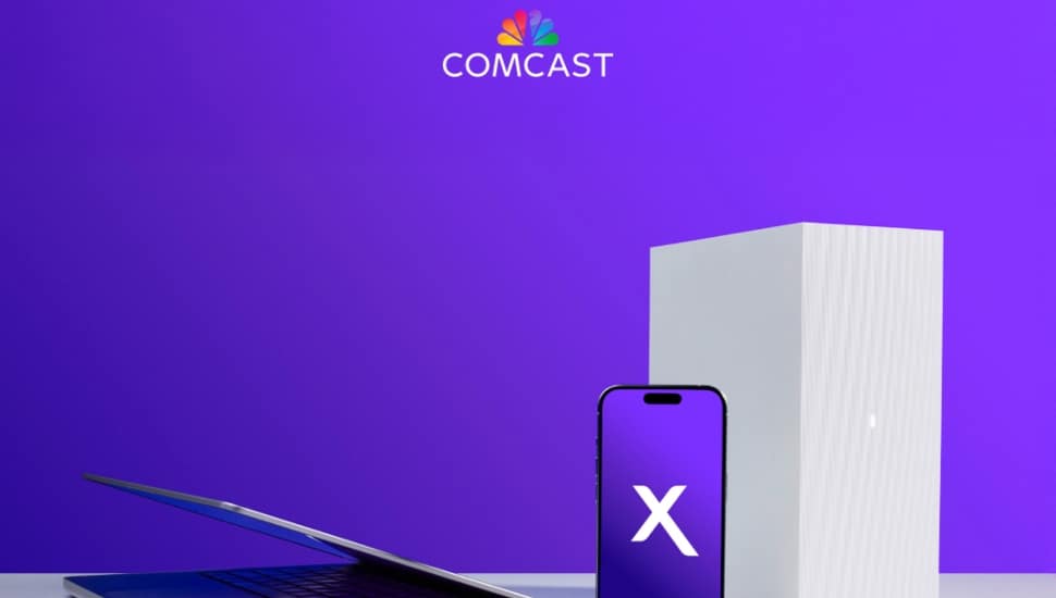 Comcast router, smartphone and laptop.