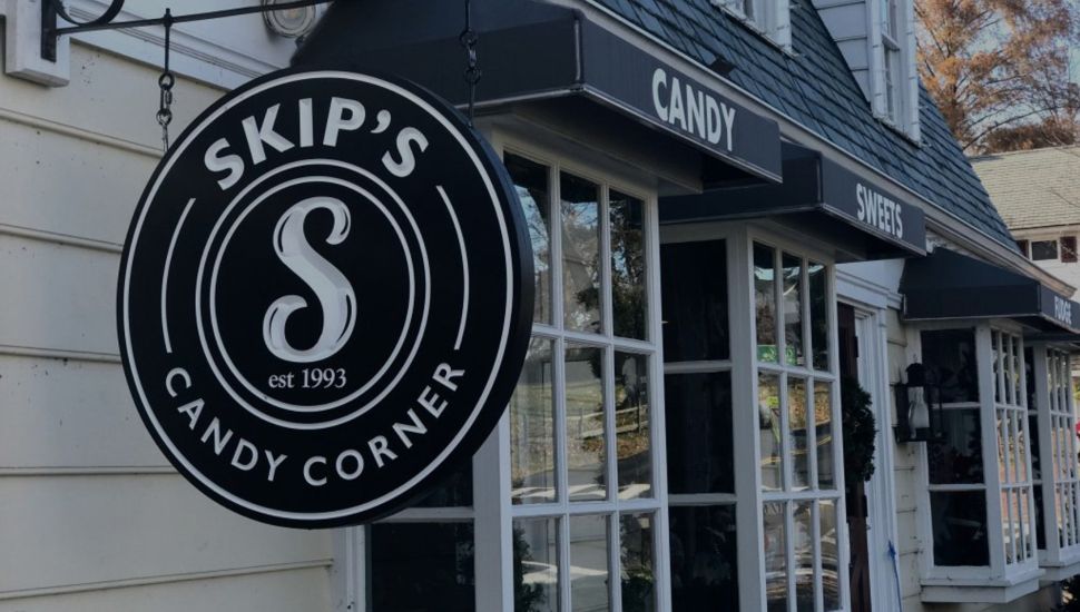 Exterior of the candy shop Skip's Candy Corner in Bucks County and its sign out front.