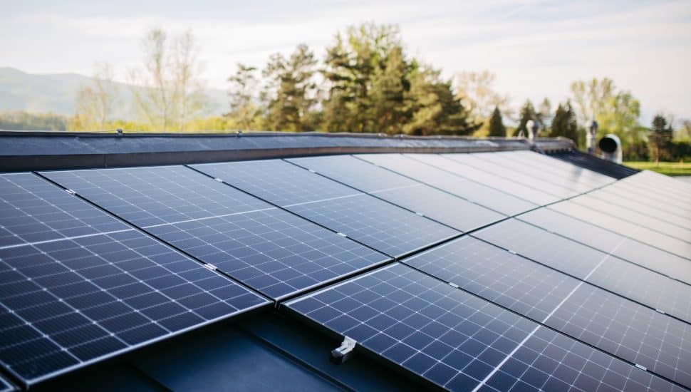 Close up of solar panels installed on a roof.