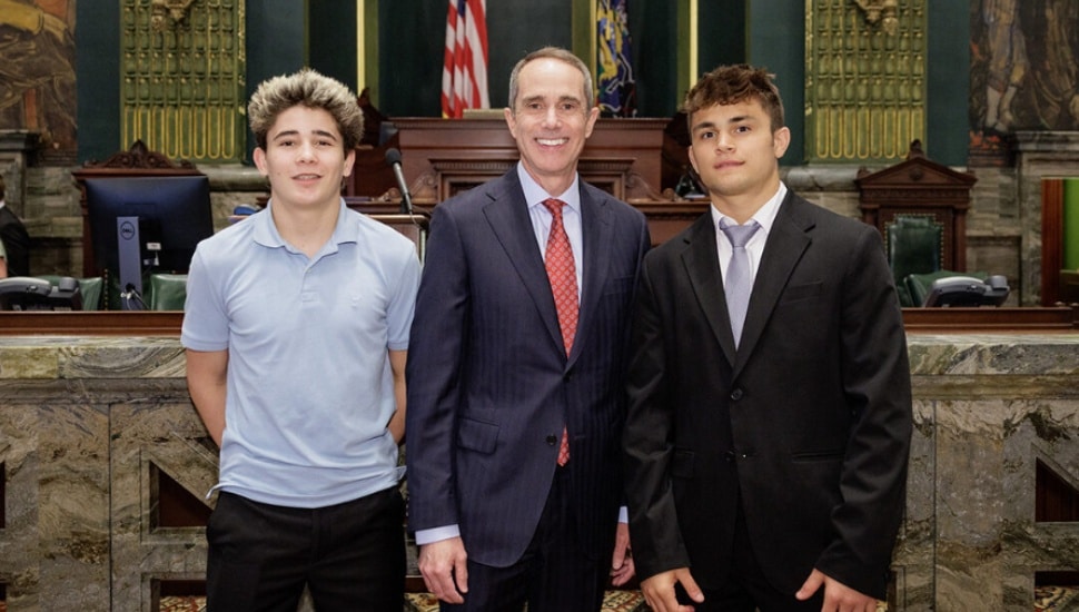 Wrestling state champions Eren Sement and Chase Williams with Senator Steve Santarsiero.