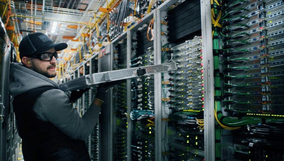 Amazon employee working in data center.