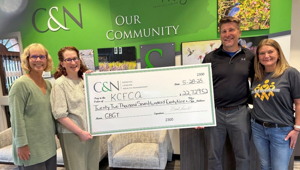 Group photo of a check donation.