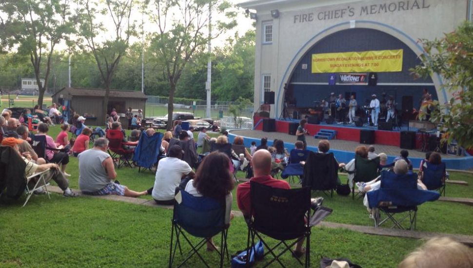 Attendees watch a stage performance in Elmwood Park.