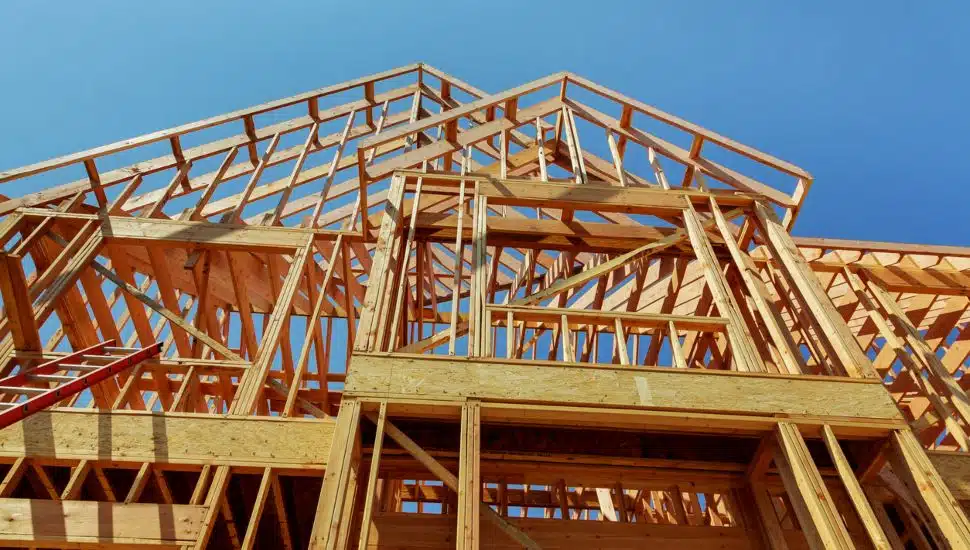 Wood framework of new residential home under construction.