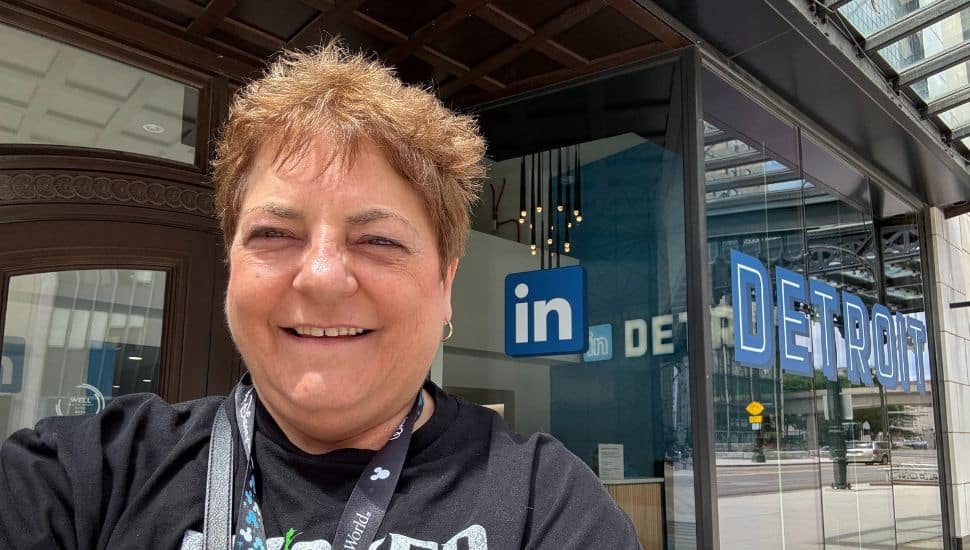 Lynne Williams is standing in front of LinkedIn's Detroit office.