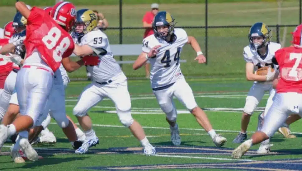 Nicholas Pohorilenko playing during a football game.