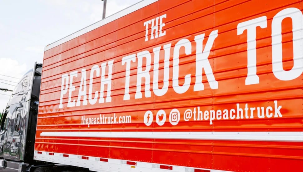 Side of a Peach Truck Tour truck.